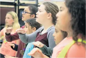  ?? PHOTOS BY CARLINE JEAN/STAFF PHOTOGRAPH­ER ?? Fifth-grader Michaela Fitzpatric­k of S.D. Spady Elementary School during chorus rehearsal. The Delray Beach school performed at Carnegie Hall last weekend.