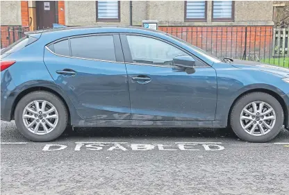  ?? Picture: Steve Brown. ?? A Dundee woman’s disabled parking bay was repainted – but mis-spelled.