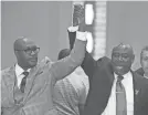  ?? JULIO CORTEZ/AP ?? Philonise Floyd, left, and attorney Ben Crump celebrate after a guilty verdict was announced at the trial of Derek Chauvin. Floyd said the family has received sympatheti­c support from near and far.