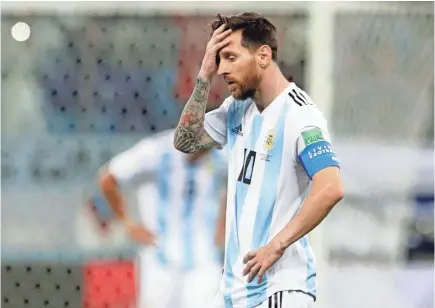  ?? PETR DAVID JOSEK/AP ?? Argentina’s Lionel Messi reacts after Croatia’s third goal Thursday in a Group D match.