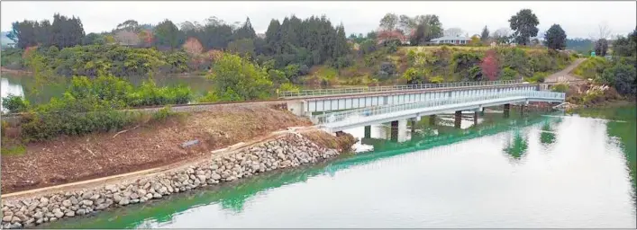  ??  ?? Bridge 3 over the Te Puna estuary is complete minus the approach ramp and remains closed until everything is finished.