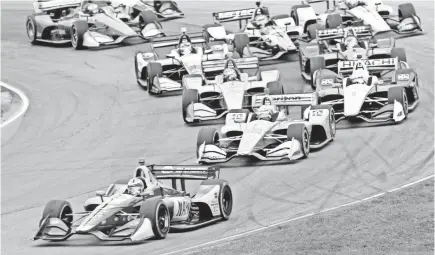  ??  ?? Alexander Rossi leads the field through a corner in the Verizon IndyCar Series race Sunday in Ohio.