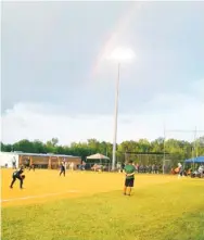  ??  ?? A rainbow following a brief rain shower rises above the Hebron Christian softball field on Monday afternoon. (Submitted photo)