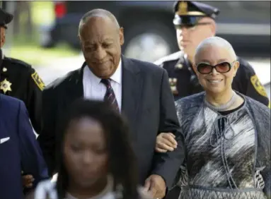  ?? ASSOCIATED PRESS ?? Bill Cosby arrives for his sexual assault trial with his wife Camille Cosby, right, at the Montgomery County Courthouse in Norristown on Monday.