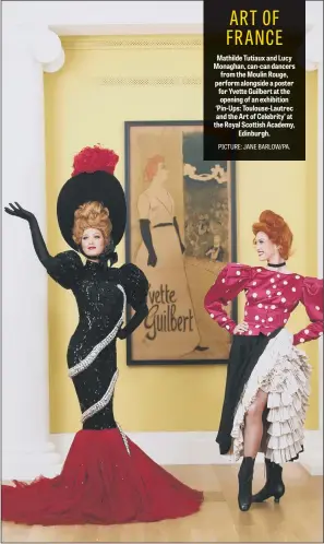  ??  ?? Mathilde Tutiaux and Lucy Monaghan, can-can dancers from the Moulin Rouge, perform alongside a poster for Yvette Guilbert at the opening of an exhibition ‘Pin-Ups: Toulouse-Lautrec and the Art of Celebrity’ at the Royal Scottish Academy, Edinburgh.