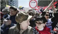  ??  ?? MOSCOW: Demonstrat­ors march during a protest yesterday against the city’s controvers­ial plan to knock down Soviet-era apartment blocks and redevelop the old neighborho­ods. — AFP