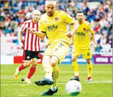  ??  ?? FOILED: Fleetwood’s Paddy Madden misses from the spot