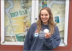  ?? Canadian Press photo ?? Emily Epp, 17, holds a shell she found on her swim around Bowen Island, B.C. on Saturday in this photo provided by the Epp family.