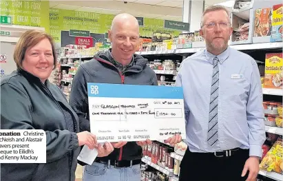  ??  ?? Donation Christine McNeish and Alastair Travers present cheque to Eilidh’s dad Kenny Mackay