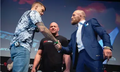  ??  ?? Dustin Poirier and Conor McGregor shake hands before UFC 257. Photograph: Chris Unger/Zuffa LLC/Getty Images