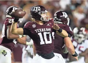  ?? Texas. GARY COSBY JR./USA TODAY SPORTS ?? Texas A&M quarterbac­k Zach Calzada throws a pass against Alabama on Saturday in College Station,