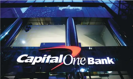  ?? ?? A branch office of Capital One Bank is pictured on May 7, 2009, in New York. Capital One Financial is buying Discover Financial Services for $35 billion, in a deal that would bring together two of the nation's biggest lenders and credit card issuers, according to a news release issued by the companies Monday, Feb. 19, 2024. (AP Photo/Mark Lennihan, File)