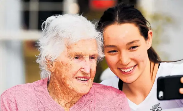  ?? Photo / Photosport ?? New Zealand’s oldest Olympian, Ngaire Galloway, shares a photo with granddaugh­ter Gina Galloway in Nelson.