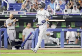  ?? Mike Carlson / Associated Press ?? Kyle Higashioka of the Yankees scores after his home run against the Blue Jays during the eighth inning on Monday, his second of the game.