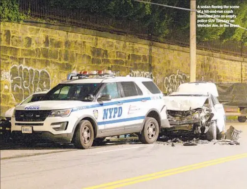  ??  ?? A sedan fleeing the scene of a hit-and-run crash slammed into an empty police SUV Tuesday on Webster Ave. in the Bronx.