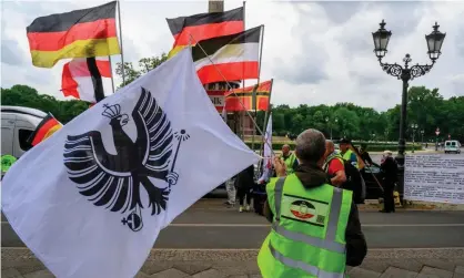  ?? Photograph: John MacDougall/AFP/Getty Images ?? A far-right protest against coronaviru­s lockdown measures in Berlin, 23 May.