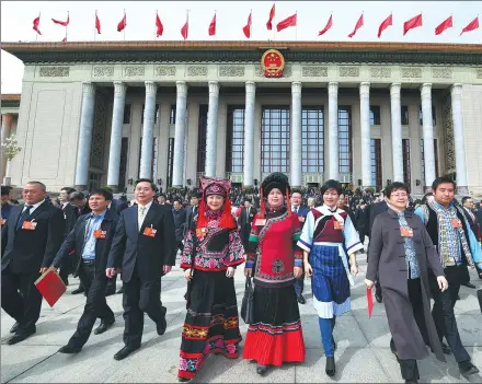  ?? YANG ZONGYOU / XINHUA ?? Deputies to the 13th National People’s Congress leave the Great Hall of the People after the top legislatur­e’s annual session concluded in Beijing on Tuesday.