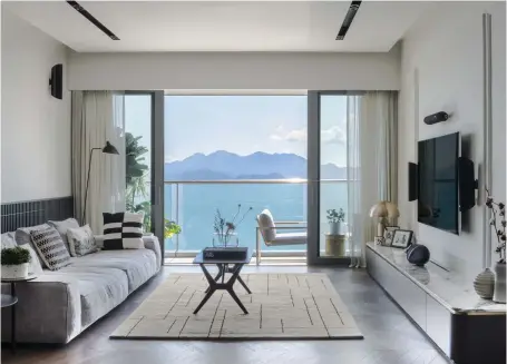  ??  ?? The ocean and sunset views dominate the living room, where Chen’s love for lines manifests in the straight-lined furniture pieces and custom joinery that draw the eye towards the horizon. The balcony is home to what Chen playfully calls his ‘own private garden’