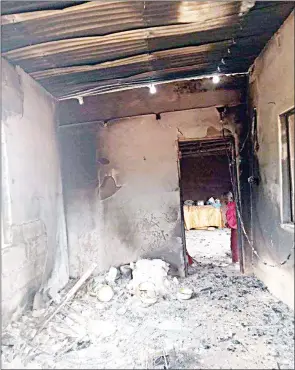  ?? (File pic) ?? One of the houses that were set on fire after the four men were burnt at Nkonka, for terrorisin­g residents.