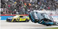  ?? AP Photo/Randy Holt ?? ■ Ryan Blaney (12) passes by Ross Chastain (1) lifting off the track after making contact with Kyle Busch, right, during the NASCAR All-Star auto race Sunday at Texas Motor Speedway in Fort Worth, Texa.