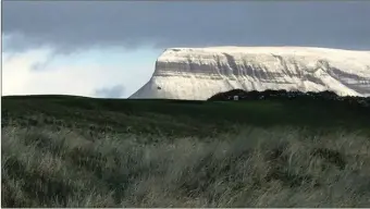  ??  ?? As Storm Fionn made its presence felt in the Northwest, it was business as usual in Co Sligo Golf Course with the links course remaining snow free as Benbulben in the distance was covered in a blanket of snow. Pic: David O’Donovan.