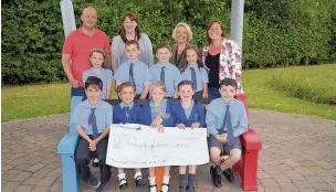  ??  ?? St Joseph’s Catholic Primary School in Reddish raised more than £800 in memory of pupil Harry Griffin Brown