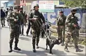  ?? PIC/PTI ?? Security personnel conduct a search operation after militants opened fire on a naka party of CRPF at Sopore in J&K