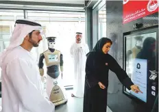  ??  ?? WAM Shaikh Hamdan Bin Mohammad takes a tour of the smart police station after inaugurati­ng it at La Mer yesterday.