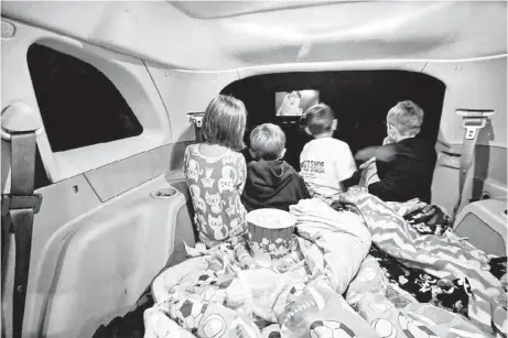  ?? Los Angeles Times ?? What better way to watch “Monsters University” than from inside the family SUV while parked at the American Dream drive-in theater in Powell, Wyo., and snuggled in your most comfortabl­e pajamas. This is the state’s first — and last — remaining drive-in...