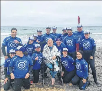  ??  ?? Greg Deveau with the Life Rolls On – They Will Surf Again team at Martinique Beach.