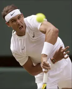  ?? AP photo ?? Rafael Nadal serves to Roger Federer during their Wimbledon semifinal Friday.