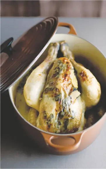  ??  ?? In Rôtis: Roasts for Every Day of the Week, Stéphane Reyhaud offers such simple suggestion­s as stuffing a chicken with a packet of Boursin cream cheese