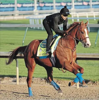  ?? CHARLIE RIEDEL THE ASSOCIATED PRESS ?? Kentucky Derby hopeful Justify runs during a morning workout Tuesday.