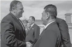  ?? AP Photo/Andrew Harnik, Pool ?? ■ U.S. Secretary of State Mike Pompeo, left, says goodbye to Kim Yong Chol, right, a North Korean senior ruling party official and former intelligen­ce chief, before boarding his plane Saturday at Sunan Internatio­nal Airport in Pyongyang, North Korea,...