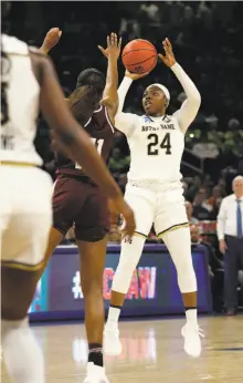  ?? Nam Y. Huh / Associated Press ?? Notre Dame’s Arike Ogunbowale shoots against Texas A&M’s Kayla Wells in the second half of a regional semifinal.