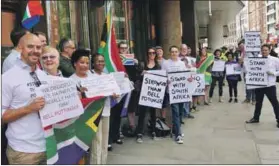  ??  ?? Call to account: The London demonstrat­ion outside Bell Pottinger, the brains behind ‘white monopoly capital’