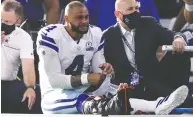  ?? TOM PENNINGTON / GETTY IMAGES ?? Although he was playing for US$31.4 million this season,
Cowboys quarterbac­k Dak Prescott and his peers are never guaranteed a clean bill of health in playing football.