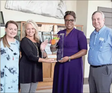  ?? / Contribute­d by Aimee Madden, City of Cedartown ?? Blair Elrod, Chamber executive director, Ramona Ruark, Downtown Cedartown director, Nija Torrence, operations manager with the GDED and Bill Fann, Cedartown city manager, gathered for a photo to receive a plaque marking the Cedartown Welcome Center as a regional stop.