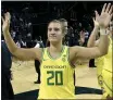  ?? CHRIS PIETSCH — AP FILE ?? Oregon’s Sabrina Ionescu acknowledg­es the crowd with teammates after a Nov. 16game against Texas Southern.