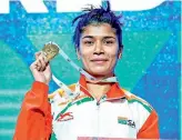  ?? ?? Nikhat Zareen flaunts gold medal which we won during the World Championsh­ip