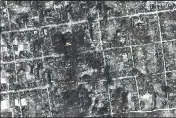  ?? MAXAR TECHNOLOGI­ES VIA AP ?? This satellite image provided by Maxar Technologi­es shows damaged areas in Petrivka of the Donetsk region, Ukraine, on Friday.