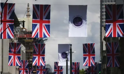  ?? ?? Union flags decorate Oxford Street in London before the platinum jubilee. Photograph: Neil Hall/EPA