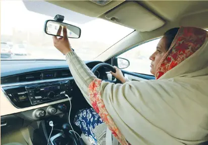  ?? (Faisal Mahmood/Reuters) ?? YASMIN PERVEEN, one of the pioneer women ‘captains’ of Careem, drives her car in Islamabad last week. Careem has a larger market share than rival Uber in most of the 32 cities in the Middle East, North Africa and Pakistan region in which it operates.