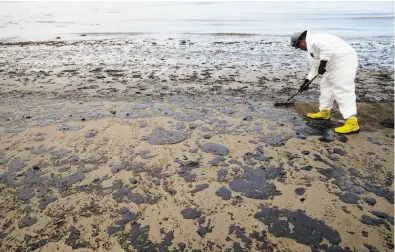  ?? Jae C. Hong / Associated Press 2015 ?? A worker removes oil from the sand at Refugio State Beach in the Santa Barbara Channel north of Goleta after an oil spill in 2015. Santa Barbara is also where California’s largest oil spill took place in 1969. The Trump administra­tion’s proposal...