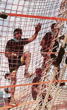  ??  ?? Shaikh Hamdan Bin Mohammad Bin Rashid Al Maktoum, Crown Prince of Dubai and Chairman of the Dubai Executive Council, going through the paces at the Sandstorm Marmoum obstacle race at Al Qudra in Dubai yesterday.