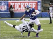  ?? BILL KOSTROUN — THE ASSOCIATED PRESS ?? Jacksonvil­le Jaguars defensive back Barry Church (42) attempts to tackle New York Giants wide receiver Odell Beckham (13) during the second half of an NFL football game Sunday in East Rutherford, N.J.