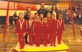  ??  ?? Top team It was a successful day for the Hamilton Gymnastics Club boys and their coaches Shona Grigor, Douglas Ross and Caitlin Ross