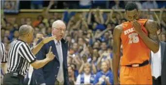  ??  ?? Syracuse coach Jim Boeheim is hit with a technical foul as Rakeem Christmas (25) walks away during the second half against Duke on Saturday.