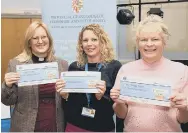  ?? Picture: Keith Woodland (041221-38) ?? IN THE MONEY Rev Amy Webb, Becky Stotesbury and Jo Jennings of the MS Therapy Centre with their cheques from the Community Chest scheme. Above right, John Whitaker, Head of the Hampshire & IoW Freemasons presents a cheque to and Jo Jennings, the centre manager