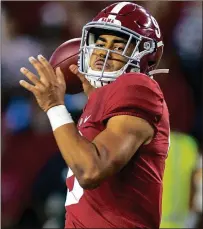  ?? Too dsaay.turday. (AP PHOTOS/FILE) ?? Matt Corral and Bryce Young are early season Heismean Trophy favorities as Alabama and Ole Miss play n